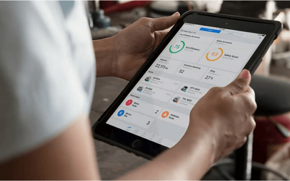 person using a tablet with Verizon Connect on it