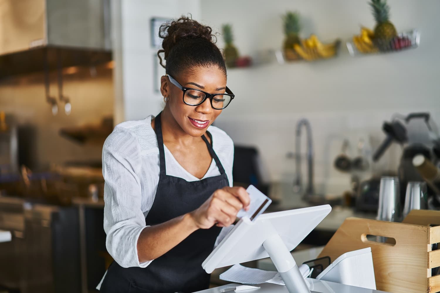 Server using a POS system in a restaurant
