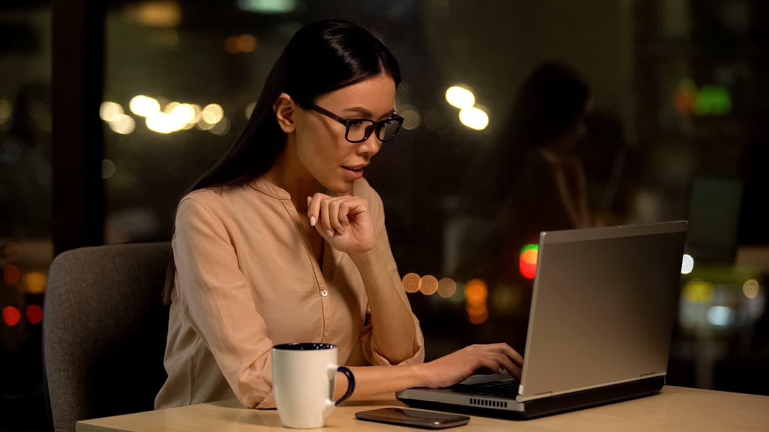 woman typing on a laptop