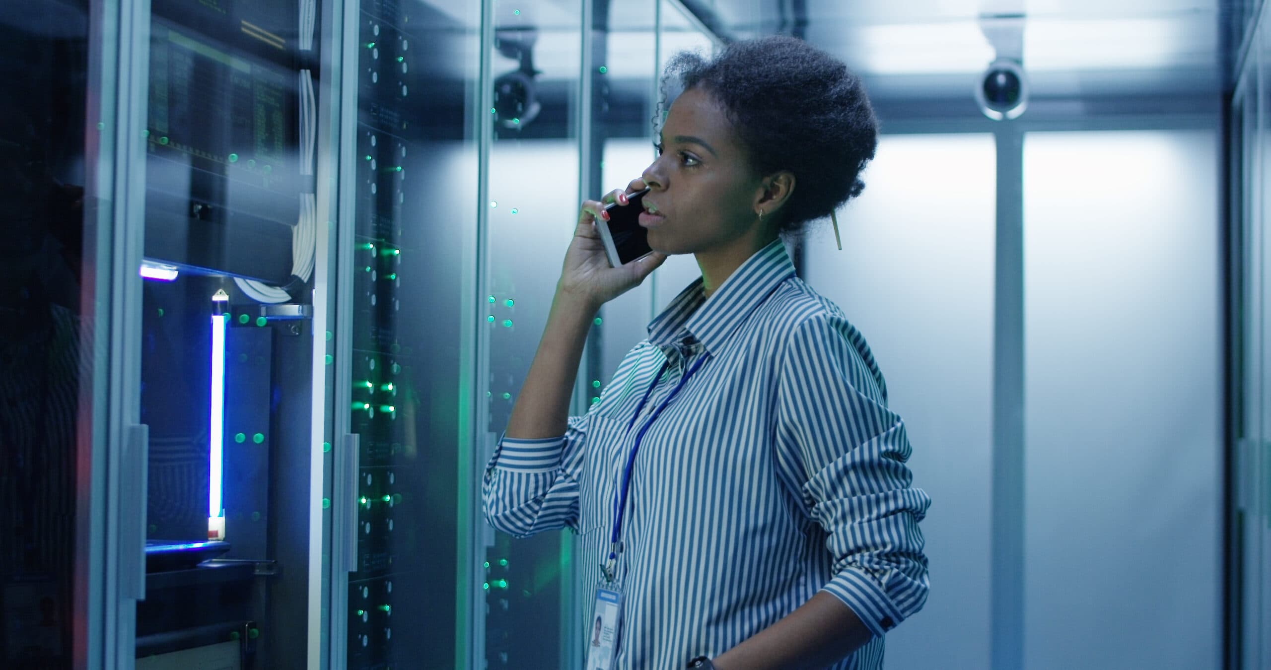 woman standing in front of a computer server