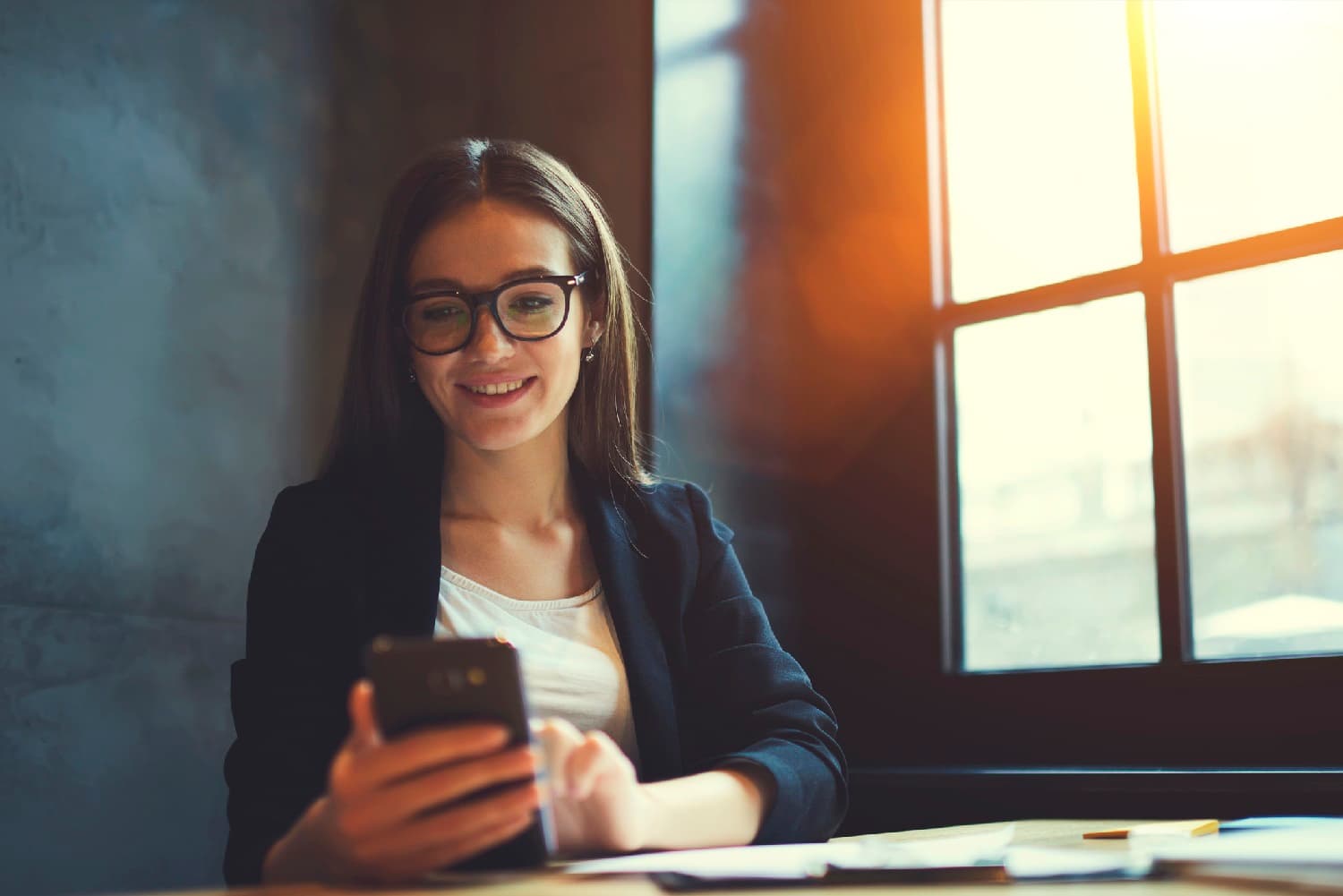 businessperson looking at their phone